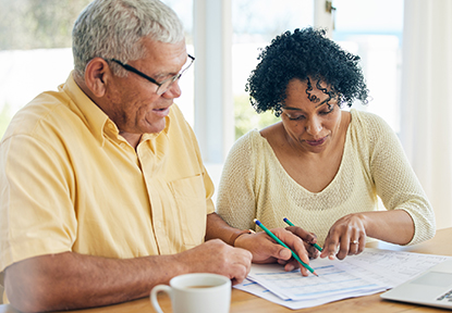 An elderly couple exploring Medicare options